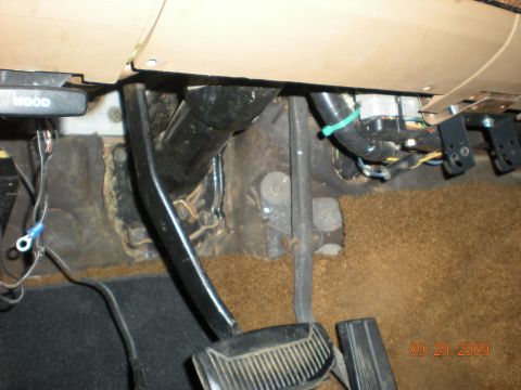 1986 Ford Bronco - The interior footwell shows pedals, exposed wiring, and a hood release lever, with a date stamp of 09.29.2009.