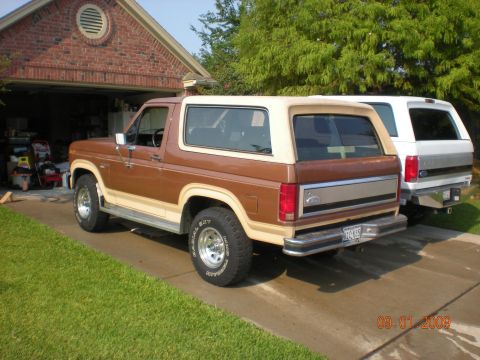 1986 Ford Bronco - A 1986 Ford Bronco is parked in the driveway next to another SUV.