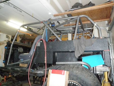 1961 International Scout 800 - Custom roll cage fabrication in progress, showing structural tubing and interior components.