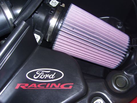 2007 Ford Mustang - Close-up of a Ford Racing branded engine cover with a performance air filter installed.