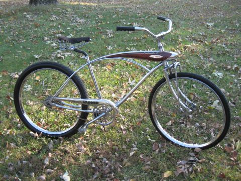 1994 Ford Bronco - A vintage-style cruiser bicycle with chrome frame and wooden accents sits on a grassy lawn.