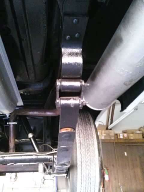 1960 Ford Falcon - Underside view of a leaf spring and exhaust system components.