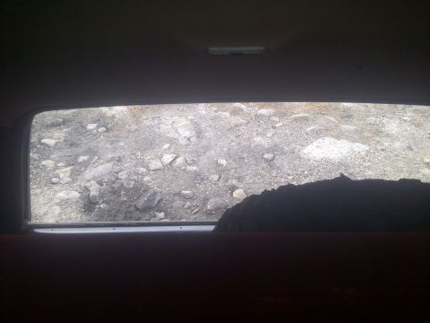 1995 Ford Bronco - View of rocky terrain from inside a vehicle.