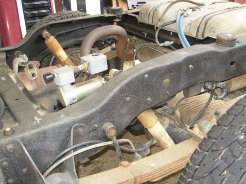 1983 Ford Bronco - These junkyard hooks (just behind the axle bumpstops under the frame) have self-closing bails, so they'll retain the tiedowns if I ever tra…