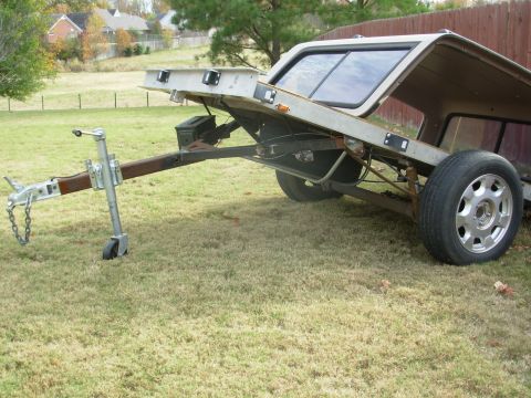2004 Land Rover Land Rover - I finally found some junkyard lift struts that would fit & work, and installed them. To keep them from hanging too low, I had to use 3. The…