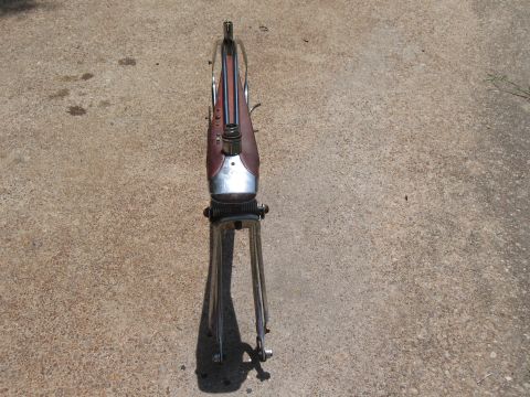 1994 Ford Bronco - Motorcycle frame and front forks shown from above, lying on a concrete surface.