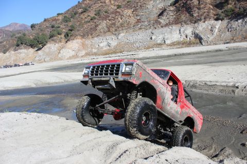 1978 Ford Bronco - Modified 1978 Ford Bronco tackling a sandy off-road course.
