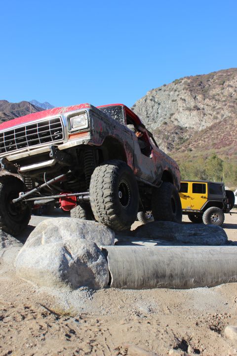 1978 Ford Bronco - Off-road Bronco navigating a rocky obstacle course with a Jeep nearby.