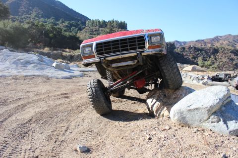 1978 Ford Bronco - This red 1978 Ford Bronco is navigating a rocky off-road course.