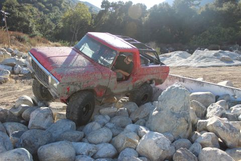 1978 Ford Bronco - A red 1978 Ford Bronco tackles a challenging rock crawling course.