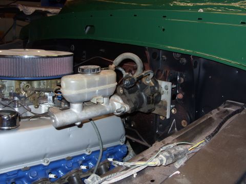 1967 Ford F-250 - Close-up view of engine bay components including the master cylinder and brake booster.