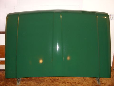 1967 Ford F-250 - A green truck hood is shown, likely for a Ford F-250, though the year is unconfirmed.