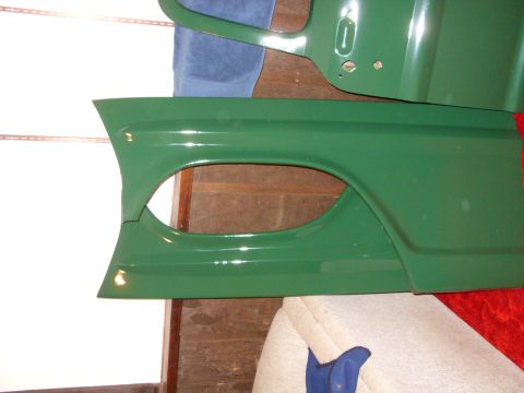 1967 Ford F-250 - Green fender and door panel, likely from a 1967 Ford F-250, are shown in this close-up.