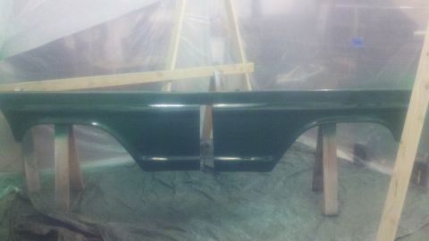 1967 Ford F-250 - Two truck bed side panels, possibly from a Ford F-250, are set up for painting.