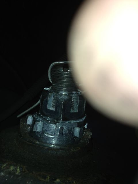 1993 Ford Bronco - Close-up of a threaded fastener with a cotter pin and castle nut.