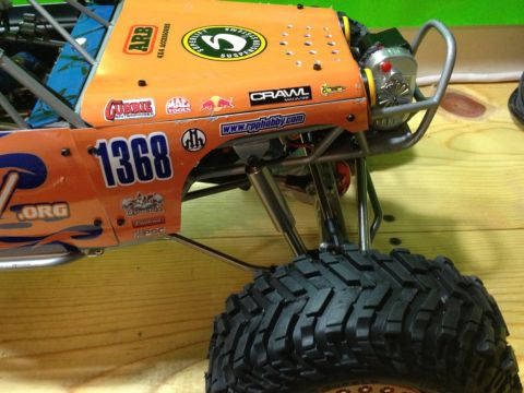 1986 Ford Bronco - This RC rock crawler features numerous sponsor decals and the number 1368 on its orange body.