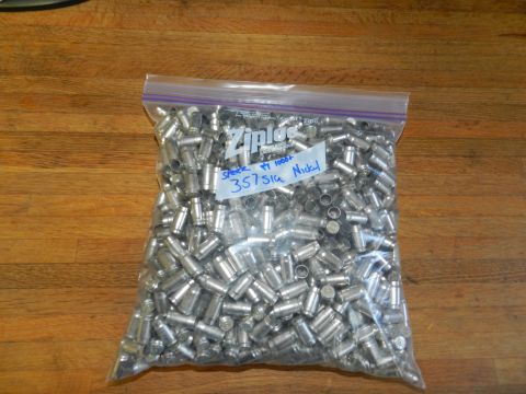 1996 Ford Bronco - Bag of spent 357 SIG nickel casings labeled 'Speer 1000+ 357 SIG Nickel'.