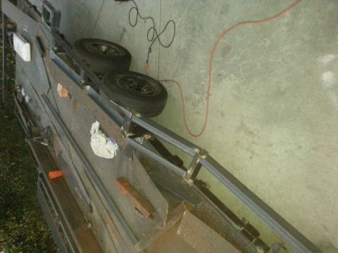 1978 Ford Bronco - Construction of a trailer frame is underway, with two wheels already mounted.