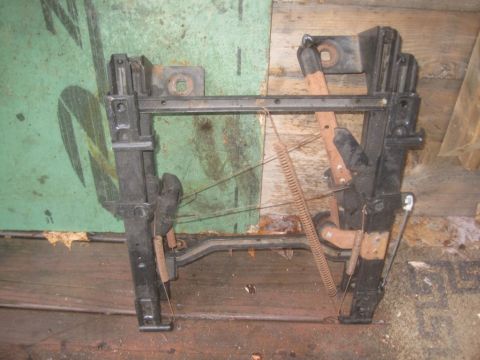 1993 Ford Bronco - A seat frame assembly with visible springs and levers is shown, likely for a vehicle part sale.