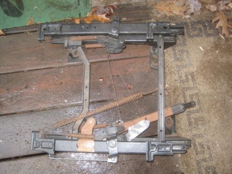1993 Ford Bronco - This is a close-up of a vehicle's seat adjustment mechanism, showing its mechanical components.