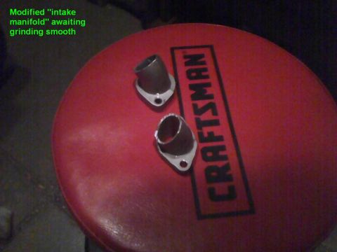 2003 Ford Crown Victoria - Modified intake manifold adapters are shown awaiting grinding smooth on a red Craftsman mat.