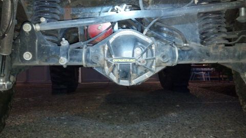 2008 Jeep Wrangler - Close-up view of the rear axle and suspension system of a vehicle.