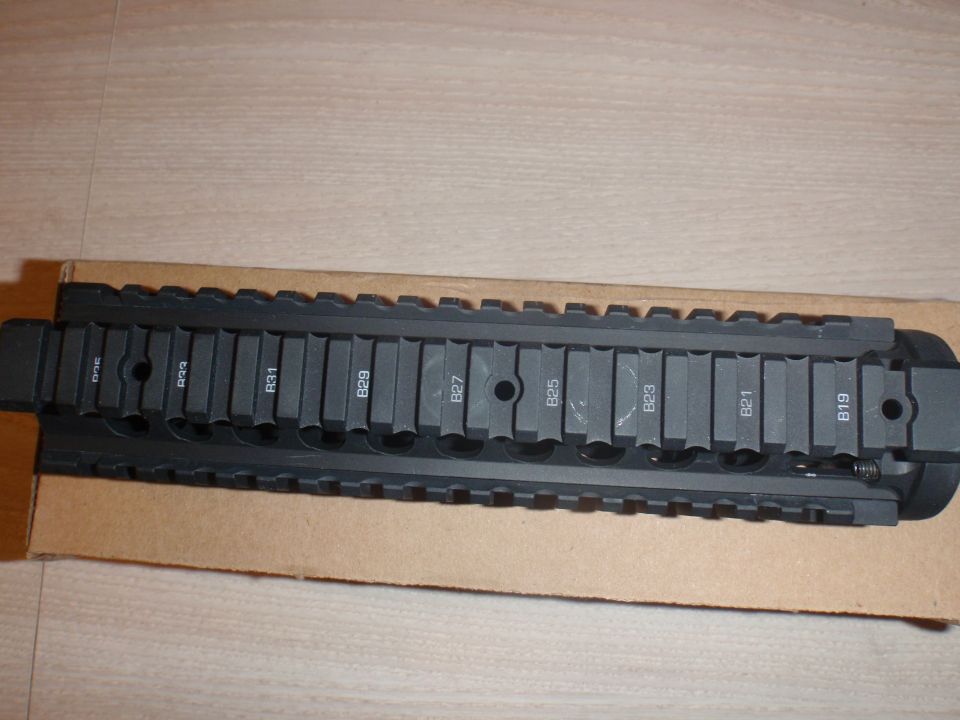 Black tactical rail system with numbered sections B19-B31
