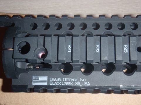 2000 Dodge 1500 - Close-up of a black accessory rail with manufacturer markings and numerical indicators.