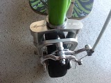 1978 Ford Bronco - Close-up of a goped scooter's front wheel assembly, highlighting its mechanical components.