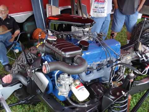 1994 Ford F-350 - Close-up of a blue V8 engine, likely from a classic vehicle, with various components visible.