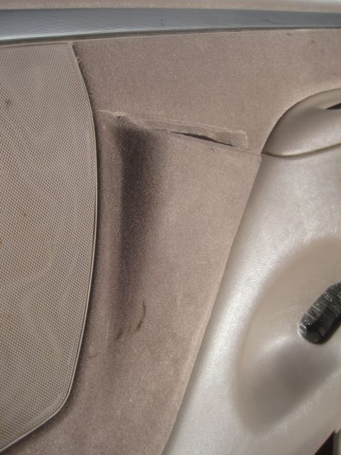 1993 Ford Bronco - Interior door panel detail showing fabric and plastic components.