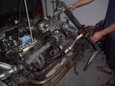 1995 Ford Probe - Custom engine bay modifications a turbocharger and extensive wiring, likely for performance enhancement.