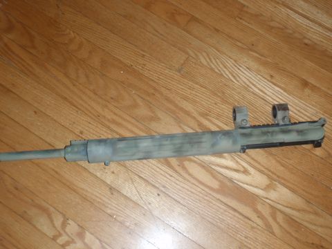 2000 Dodge 1500 - A rifle barrel with scope mounts is shown on a wooden floor.