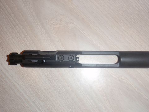 2000 Dodge 1500 - This is a close-up view of an AR-15 bolt carrier group, a firearm component.
