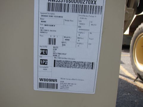 1991 Ford LTD Crown Victoria - Military shipping/data plate showing equipment description, serial/package ID, weights, and consignee barcodes.