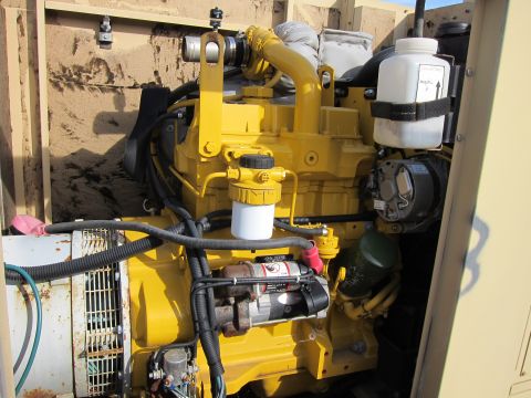 1991 Ford LTD Crown Victoria - Close-up view of a yellow engine assembly, showing various components and wiring.