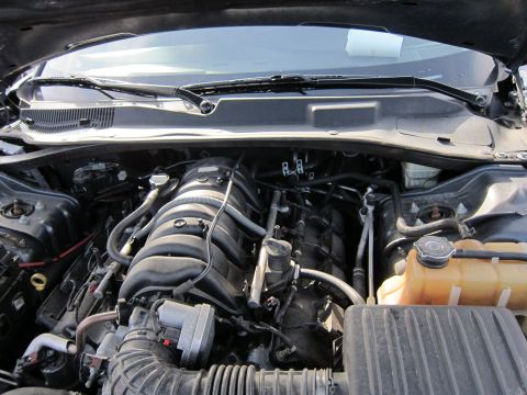 1991 Ford LTD Crown Victoria - The engine bay of a vehicle is shown with various components and wiring.