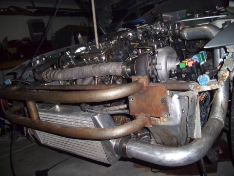 1995 Ford Probe - Custom turbocharged engine bay a large intercooler and exhaust manifold.