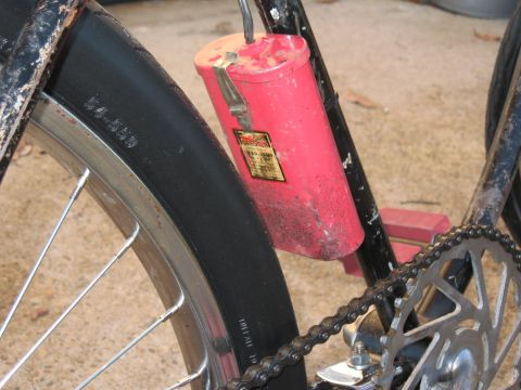 1994 Ford Bronco - Close-up of a bicycle's rear wheel area showing a tire and a red component.