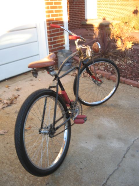 1994 Ford Bronco - A vintage bicycle with a classic design is parked outside a brick house.