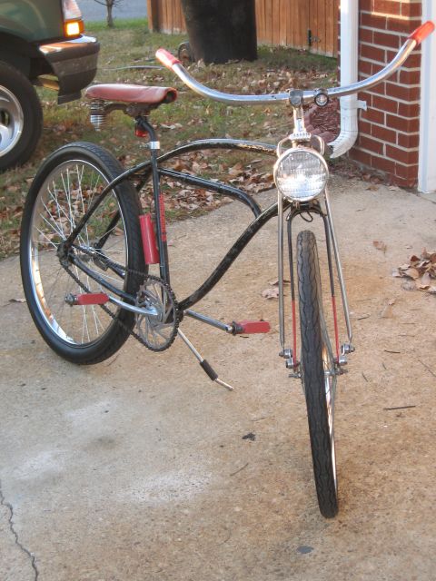1994 Ford Bronco - A custom cruiser bicycle with a vintage aesthetic is parked on a concrete driveway.