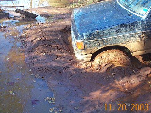 1986 Ford Bronco - This 1986 Ford Bronco is deeply stuck in thick mud and water.