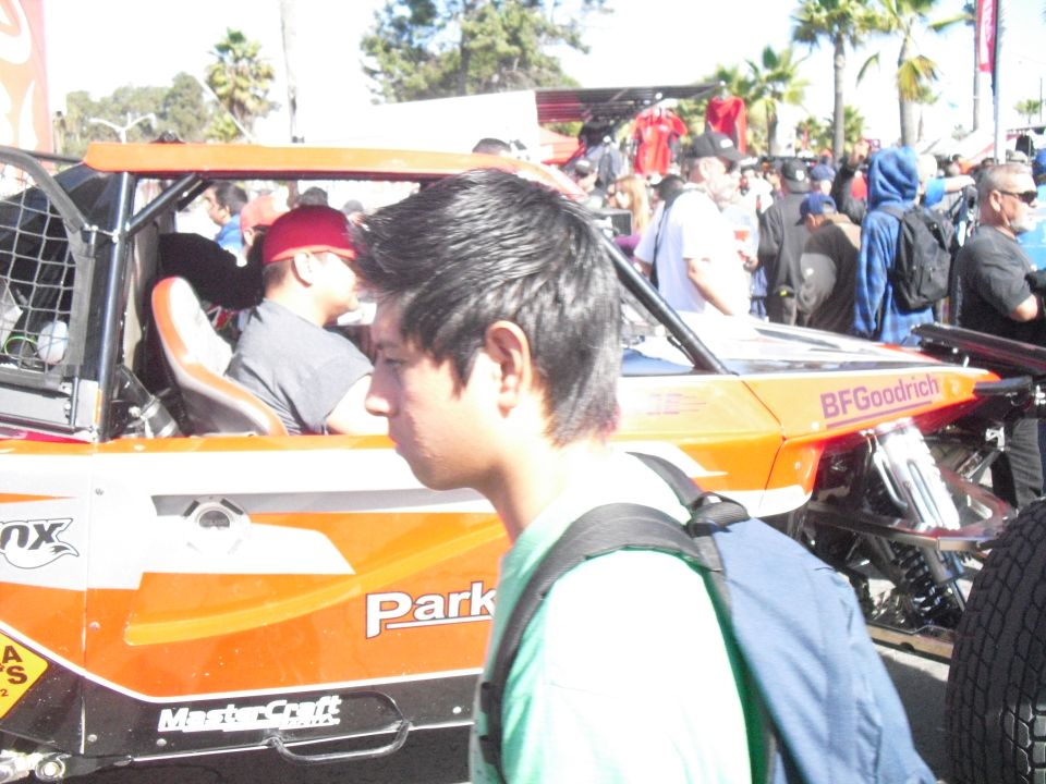 Off-road buggy with BFGoodrich tire branding and 'Park' text, people in background