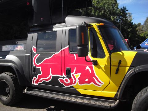 1986 Ford Bronco - This truck is decorated with Red Bull branding and appears to be a support vehicle.