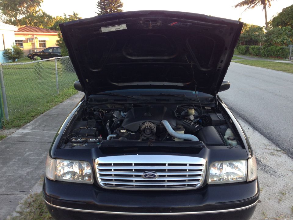 2001 Ford Crown Victoria engine bay with hood open, front grille visible