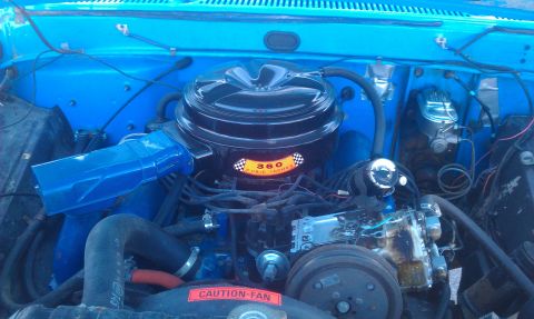 1973 Ford F-100 - Close-up of the engine bay, a prominent air cleaner with cubic inch displacement.