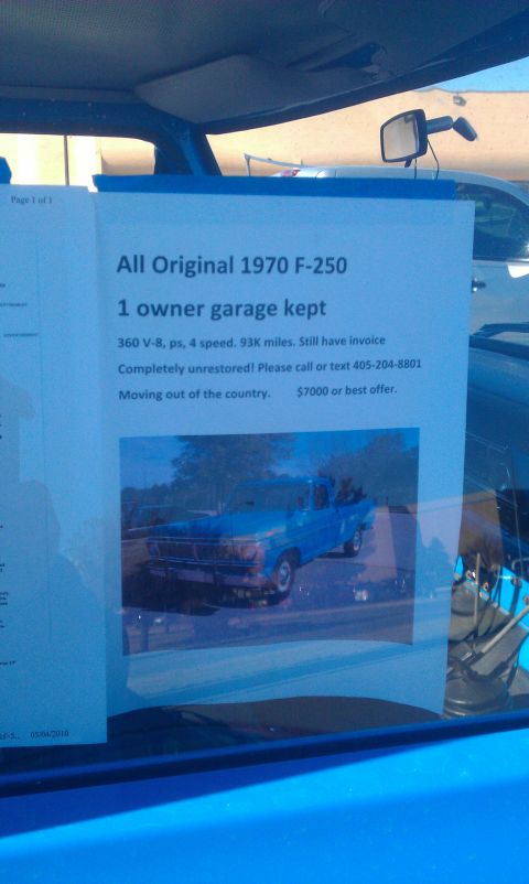 1973 Ford F-100 - A document inside a vehicle advertises a 1970 Ford F-250, contradicting the registry's claim of a 1973 F-100.