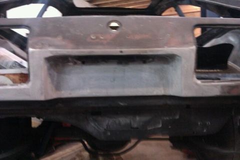 1978 Ford Mustang II - Unfinished rear panel and suspension of a car undergoing restoration. The registry claims 1978 Ford Mustang II, but this is unconfirmed.