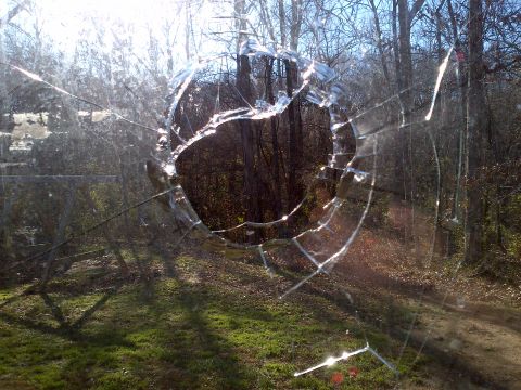 2007 Dodge Durango - View through a shattered windshield shows trees and a dirt path.