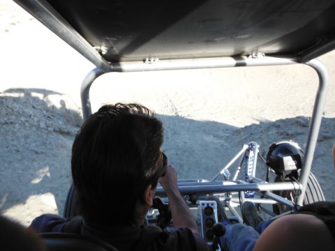1979 Ford Bronco - View from the driver's seat of a dune buggy navigating a desert landscape.